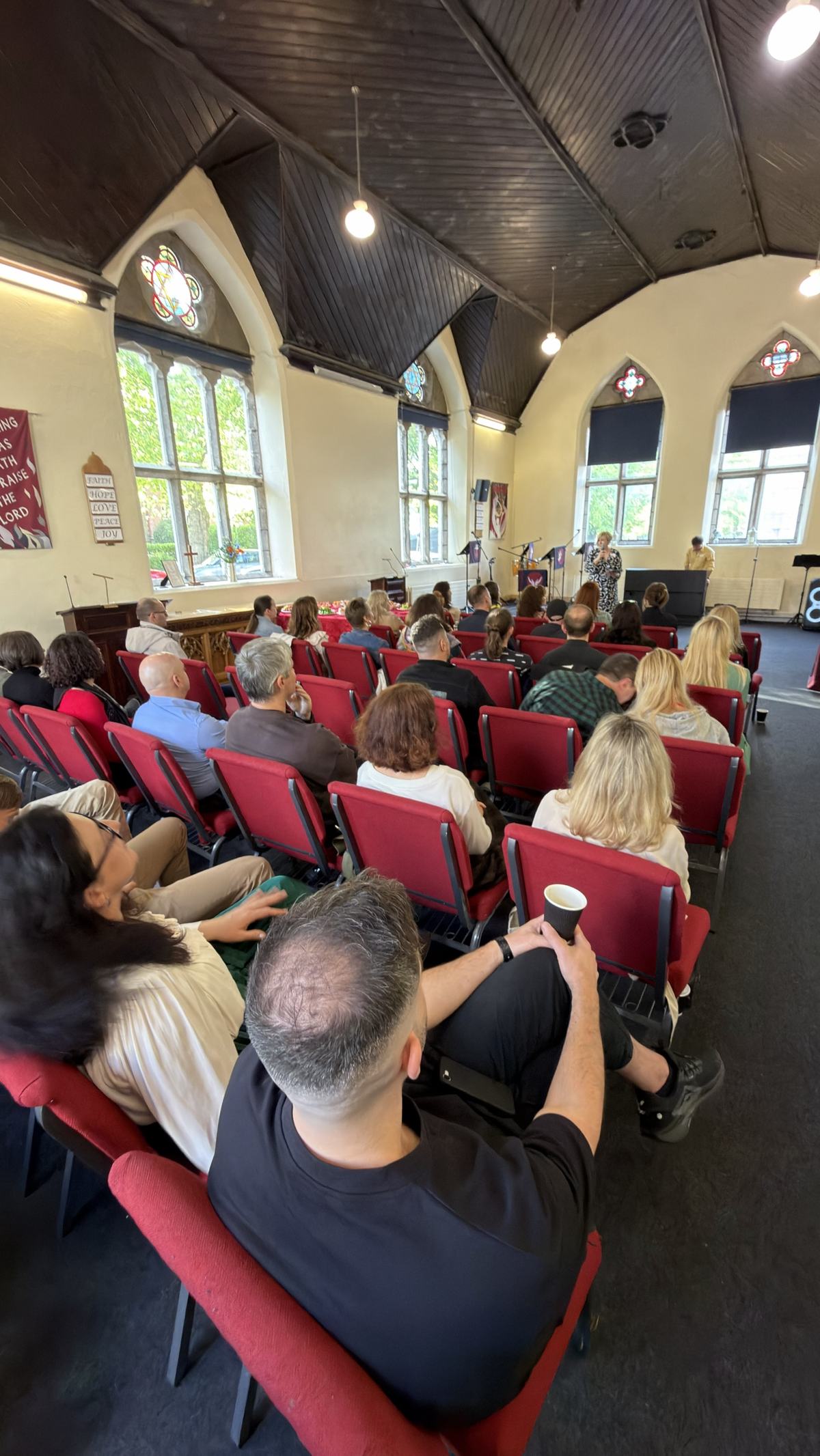 A full hall of guests seated at the Networking & Friends meeting