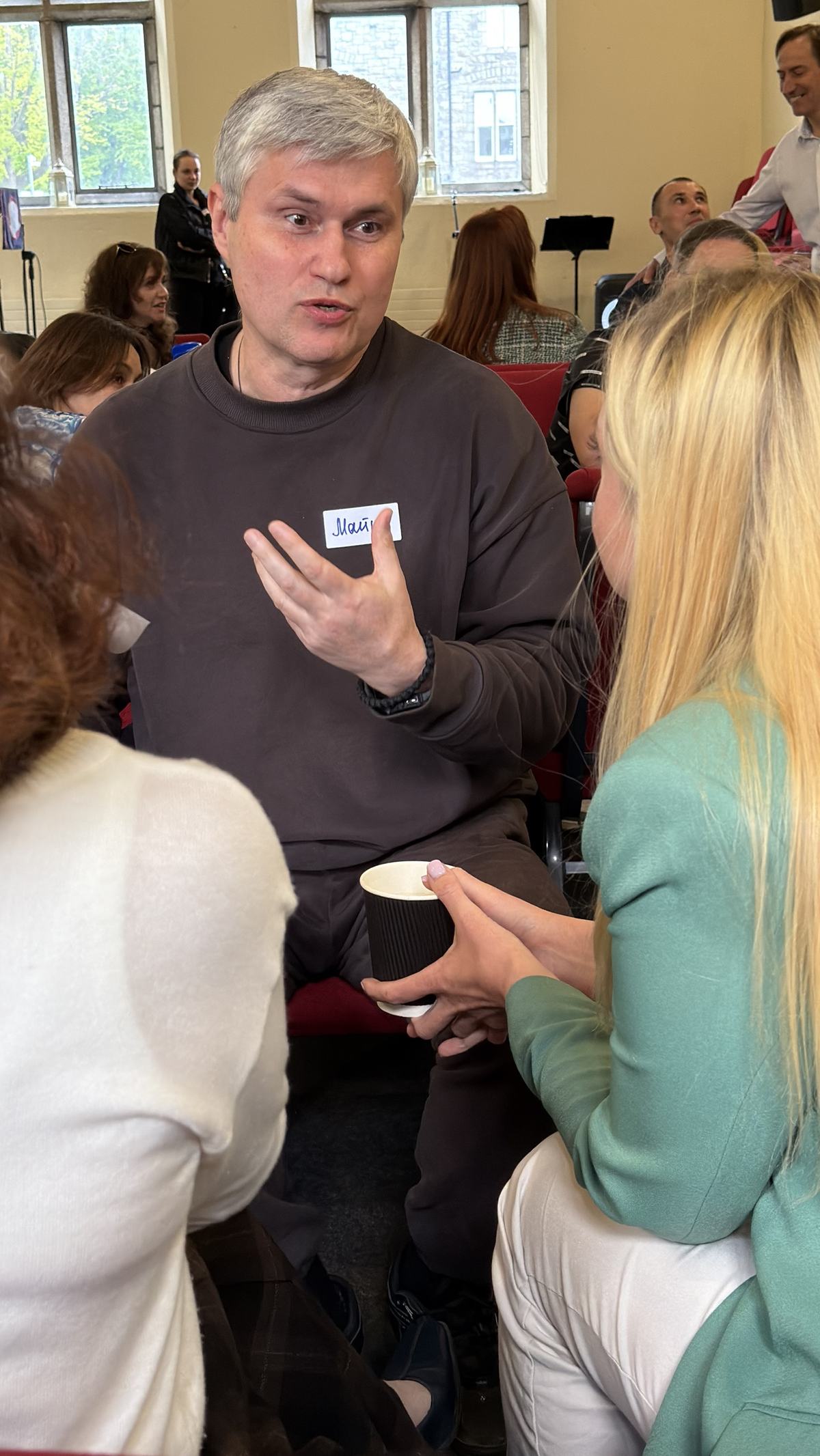 Guests in conversation in a small group at Networking & Friends